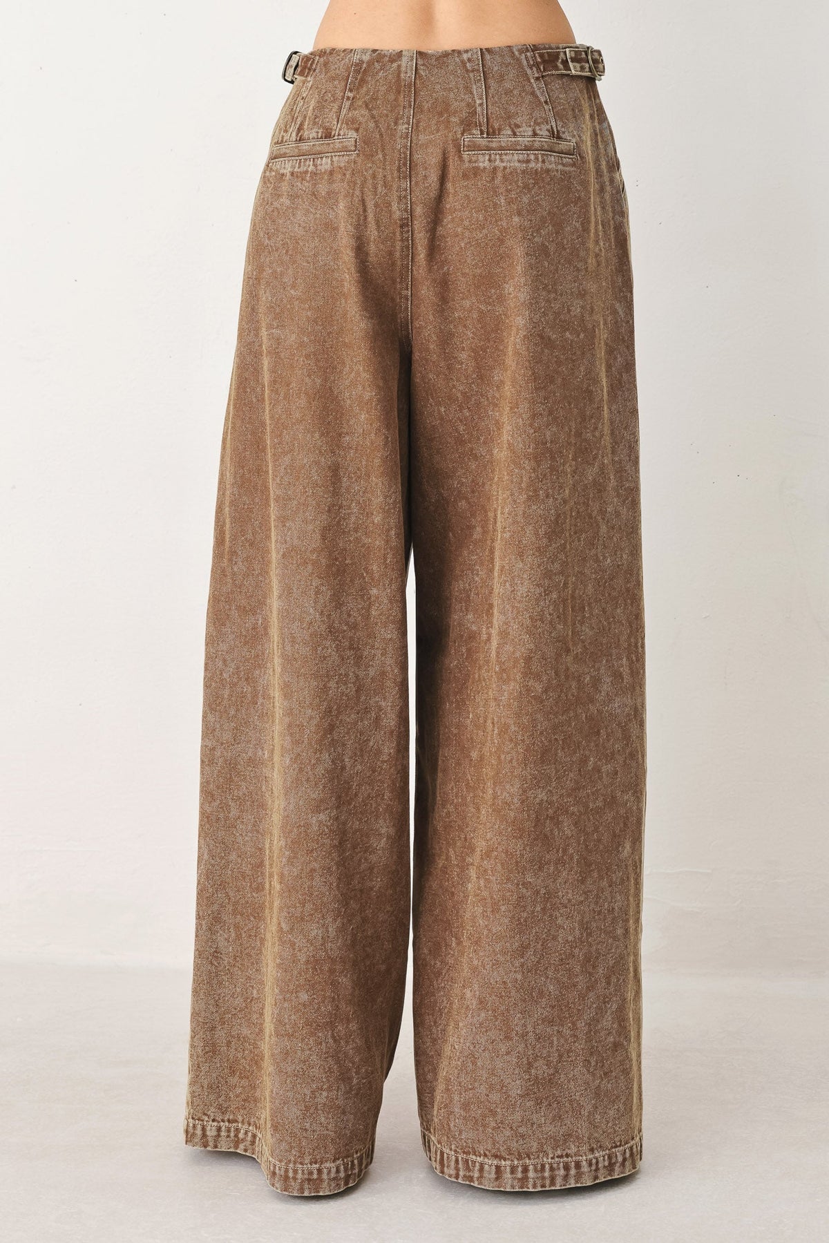 Vintage brown denim pants from Flying Tomato, showcasing classic fit and detailed stitching on the fabric.