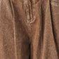 Vintage brown denim pants by Flying Tomato, showing the front view with classic stitching and relaxed fit.