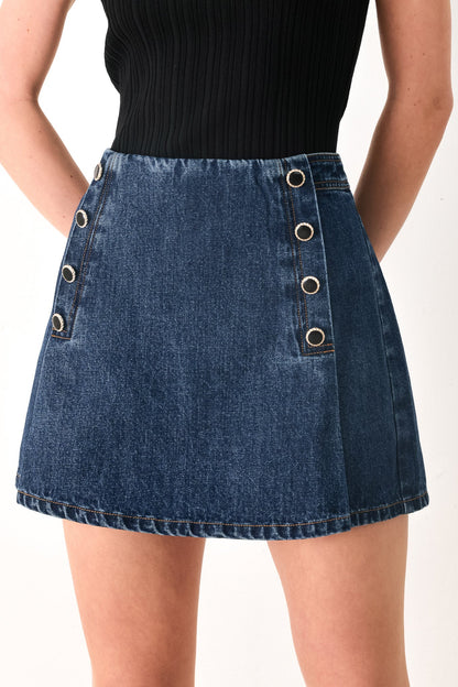 Flying Tomato Run The City denim skort in indigo, showcasing a stylish casual skirt with front pockets and a button closure.