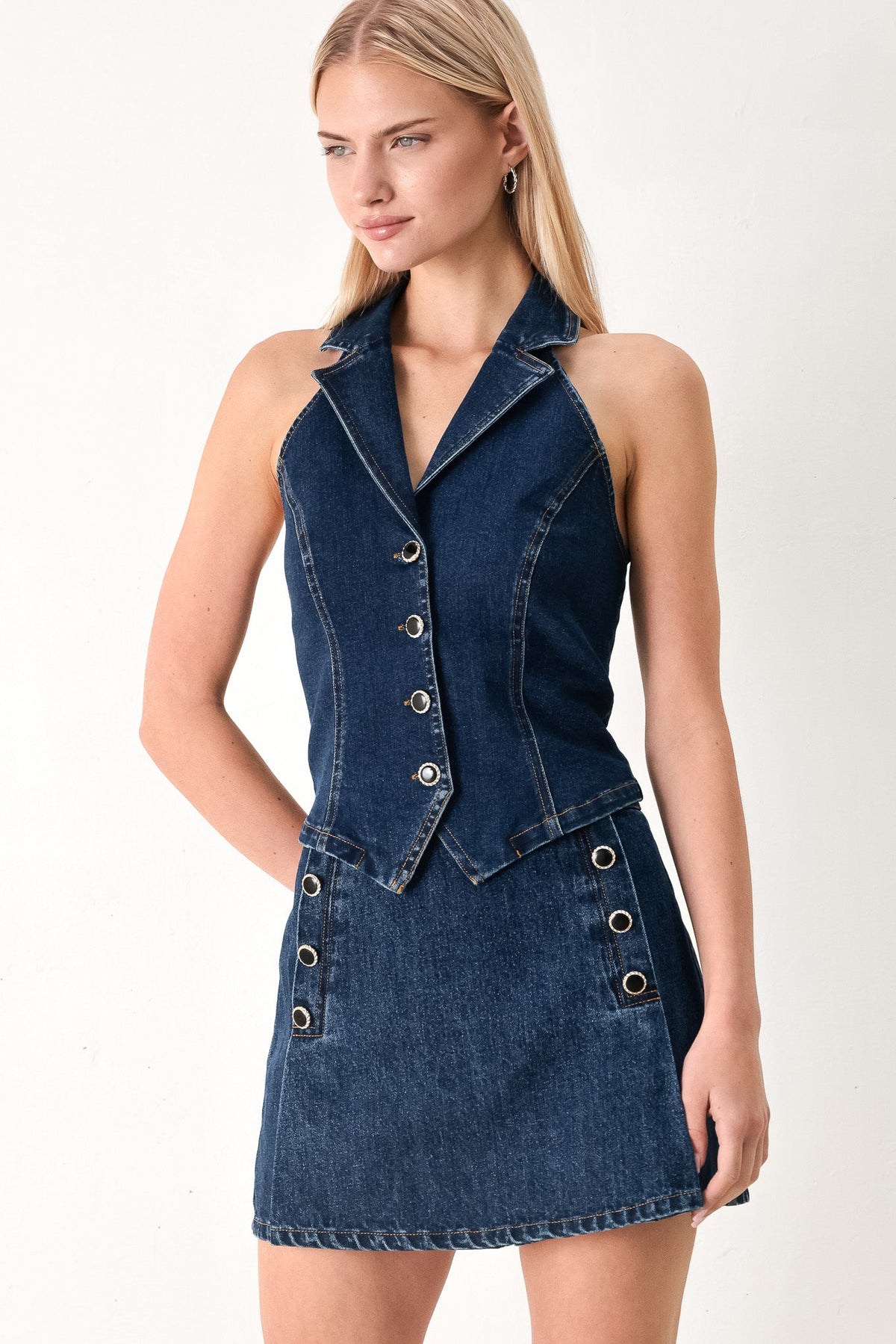 Flying Tomato Run the City denim skort in indigo, featuring a stylish front and back view with belt loops and side pockets.