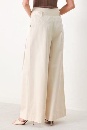 Flying Tomato Vela Wide Woven Pants in ecru with a relaxed fit and woven texture, displayed on a neutral background.
