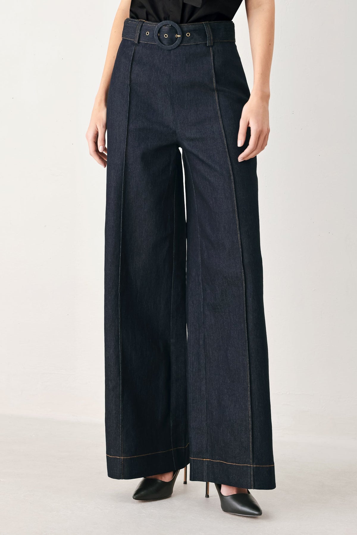 Dark denim Urban Stitch pants by Flying Tomato, showcasing classic jeans style with detailed stitching and a fitted design.