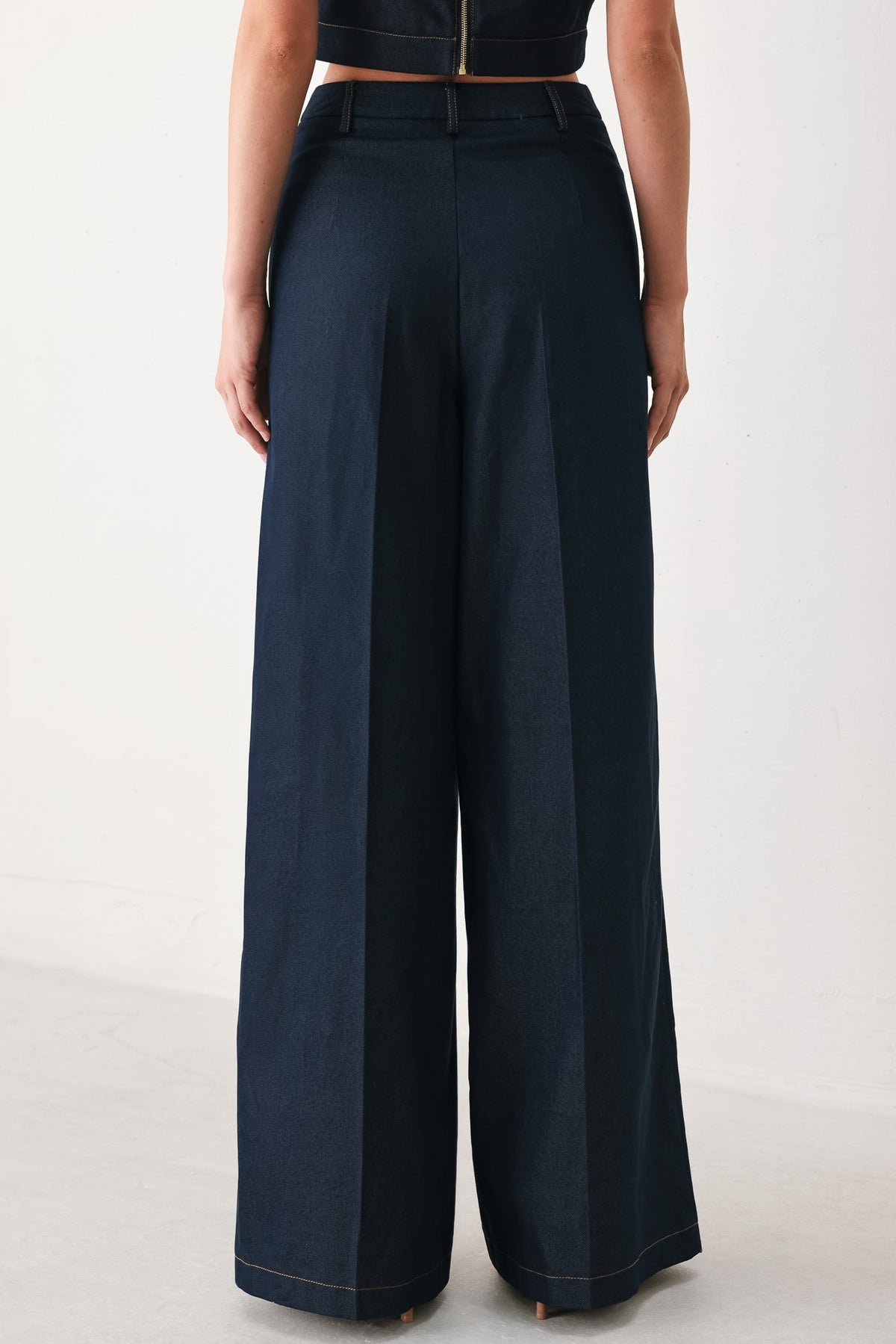 Flying Tomato Yacht Club woven wide-leg pants in indigo with a relaxed fit and wide leg design, displayed on a hanger.