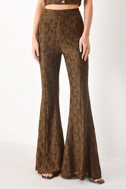 Flying Tomato Moonlight Boho woven pants in brown with relaxed fit and intricate woven patterns, displayed lying flat.