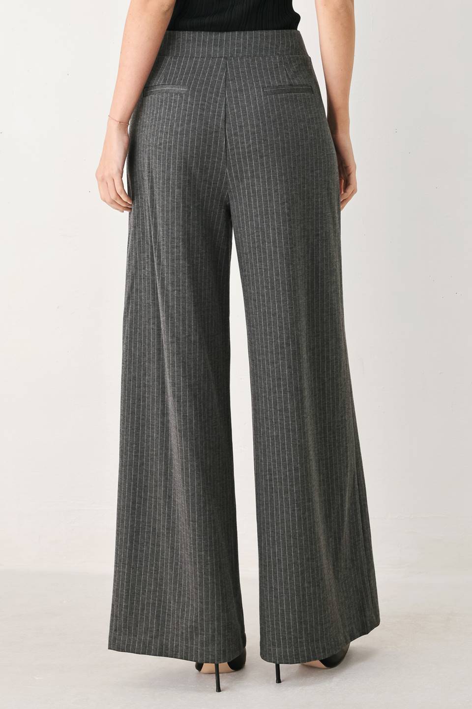 Charcoal and white pinstripe woven pants by Flying Tomato, featuring a modern tailored fit and stylish design.