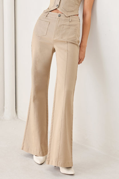 Flying Tomato Portofino woven pants in taupe, featuring a relaxed fit and textured fabric, shown on a model.