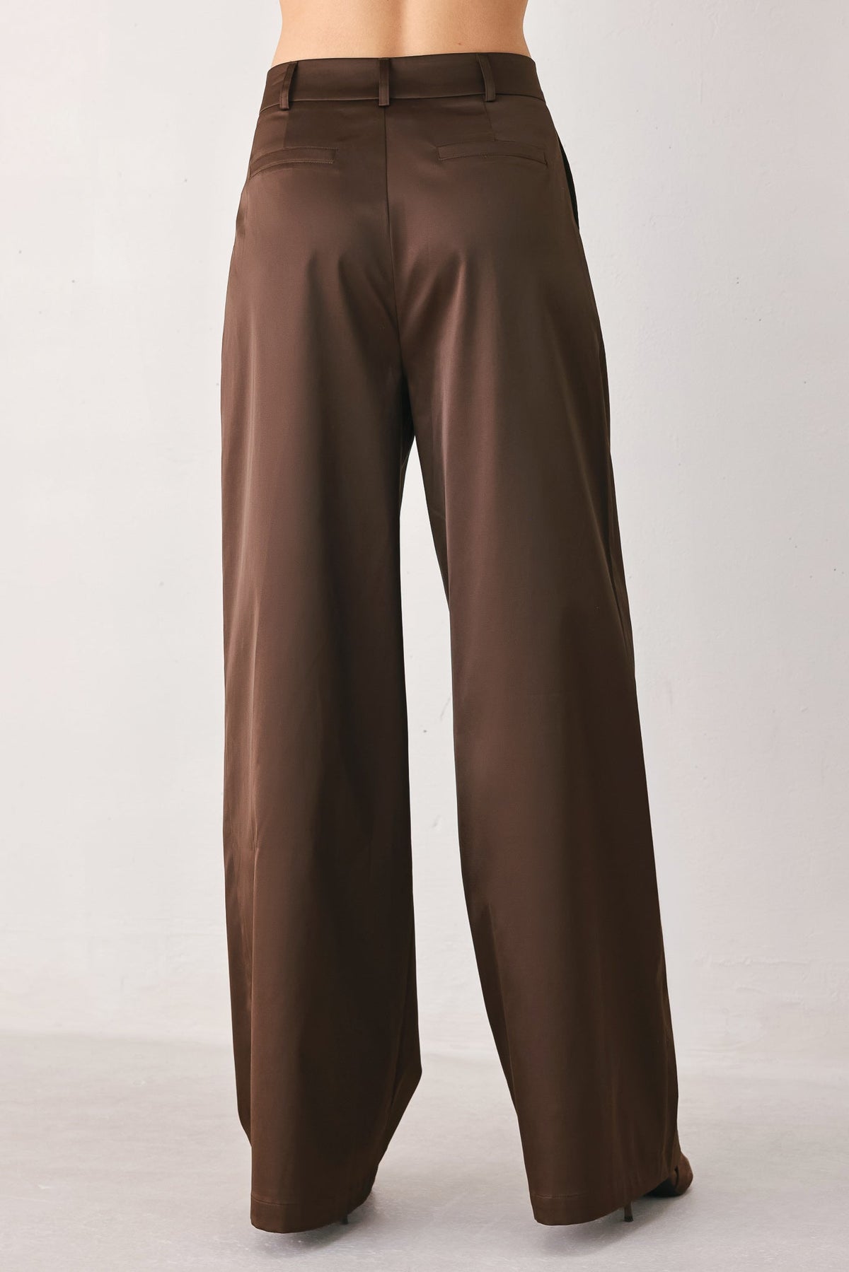 Flying Tomato parchment relaxed-fit woven pants in brown, showing the comfortable, casual waistband and textured fabric detail.