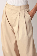 Relaxed-fit woven pants by Flying Tomato in a champagne color, featuring a comfortable, casual design with a subtle textured fabric.