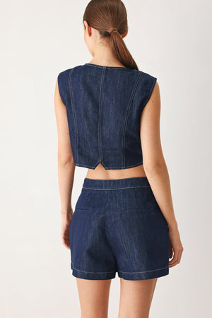 Flying Tomato iconic indigo denim skort with front pockets and button closure, styled with casual fabric and stitching details.