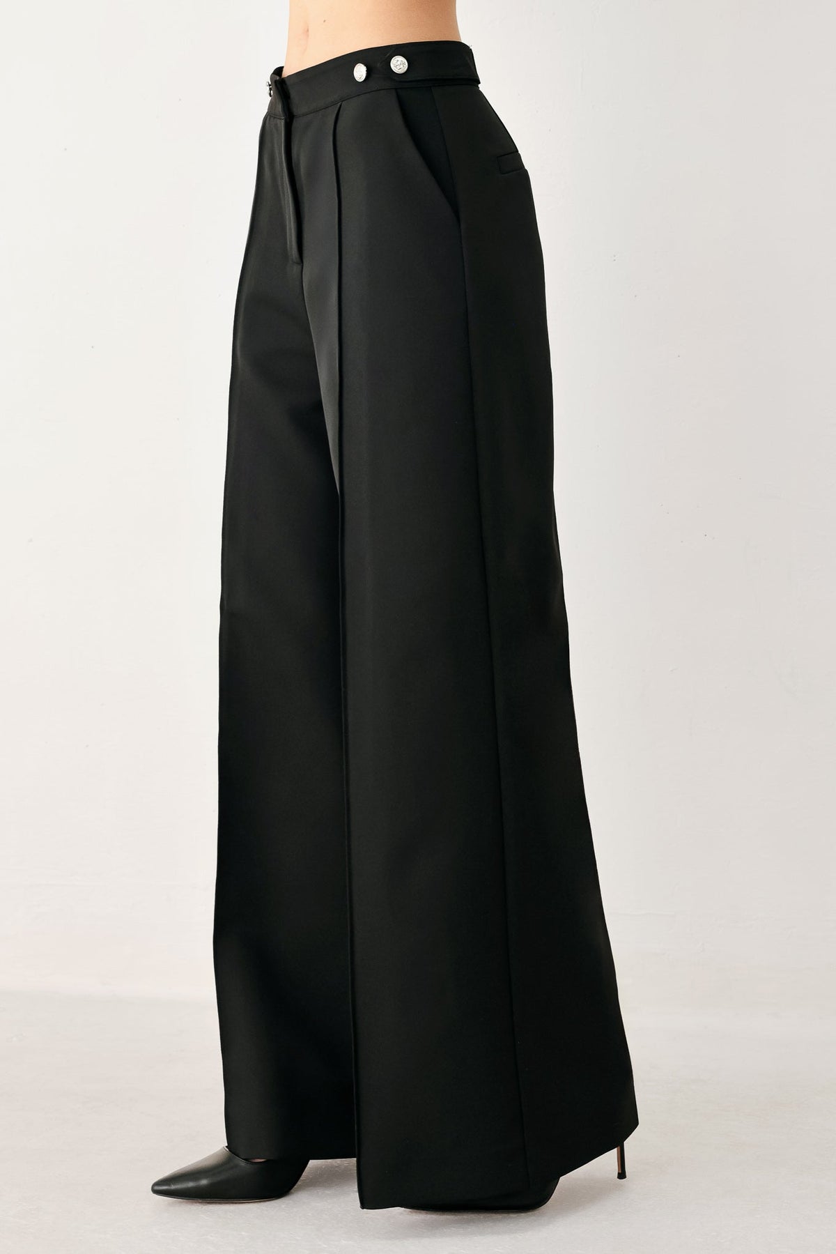 Black Power Palazzo woven pants by Flying Tomato, featuring wide-leg design and intricate woven fabric details.