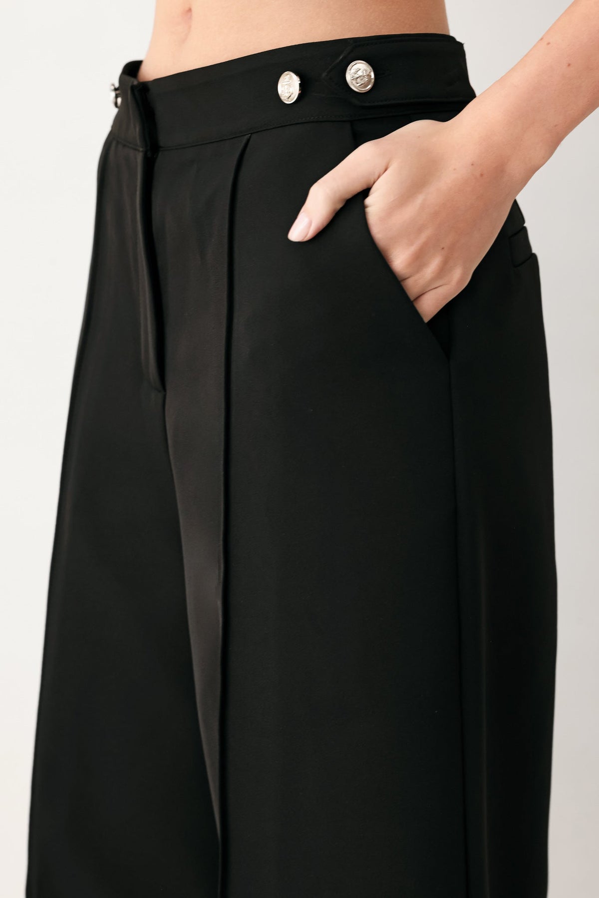 Black Power Palazzo woven pants by Flying Tomato, featuring wide-leg design and woven fabric, shown on a model.