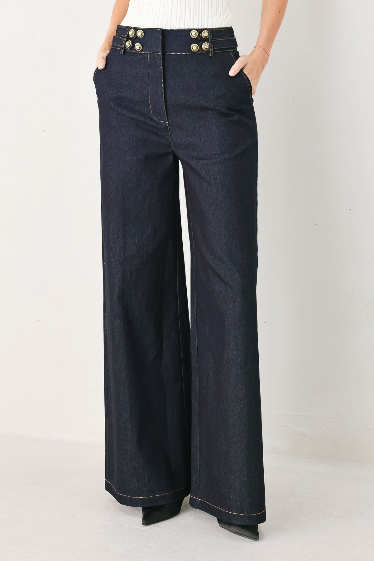Dark indigo denim pants by Flying Tomato, featuring classic five-pocket style and straight-leg cut.