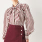 Flying Tomato Merlot Ridge woven skort in burgundy, showing the textured fabric, front zipper, and waistband detail.