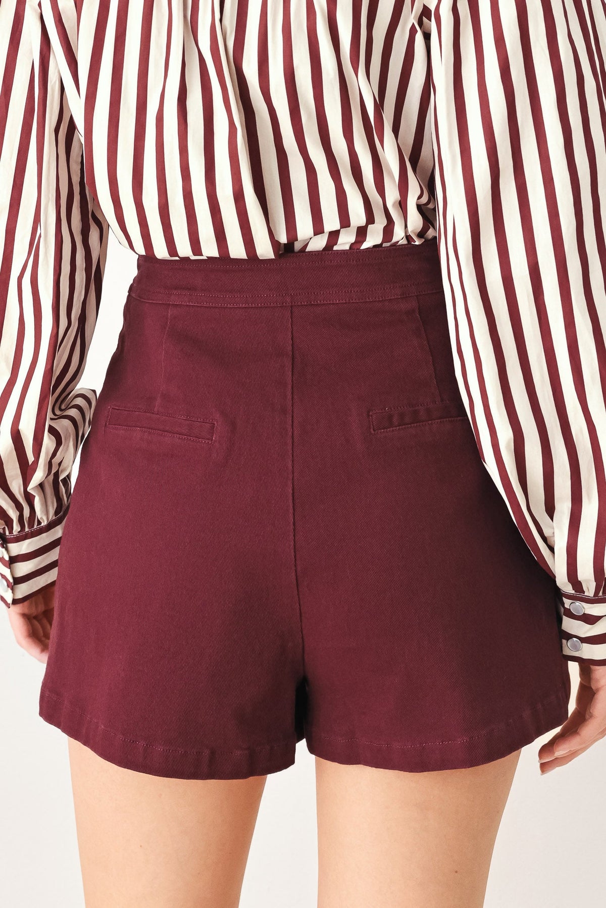 Flying Tomato Merlot Ridge woven skort in burgundy, lightweight fabric with a comfortable waistband and side pockets.