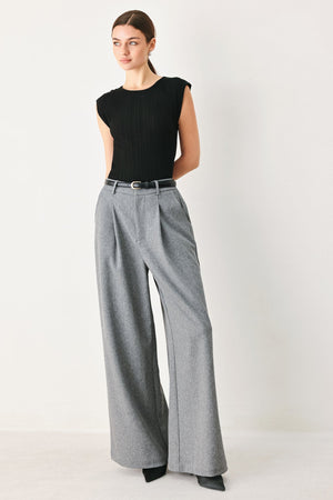 Flying Tomato Granite Flow woven pants in grey, showing the relaxed fit and textured fabric details.