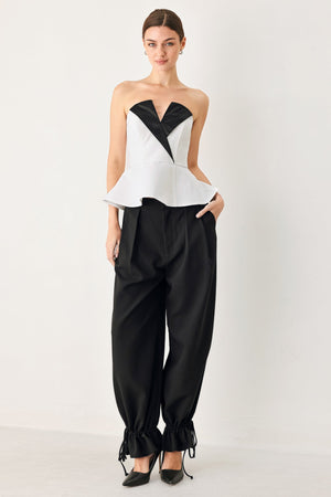 Black Noir drawstring woven pants by Flying Tomato, featuring relaxed fit and casual style, displayed on a hanger.
