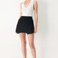 Flying Tomato Uptown Flirt woven skort in black, featuring a stylish design with a comfortable waistband and lightweight fabric.