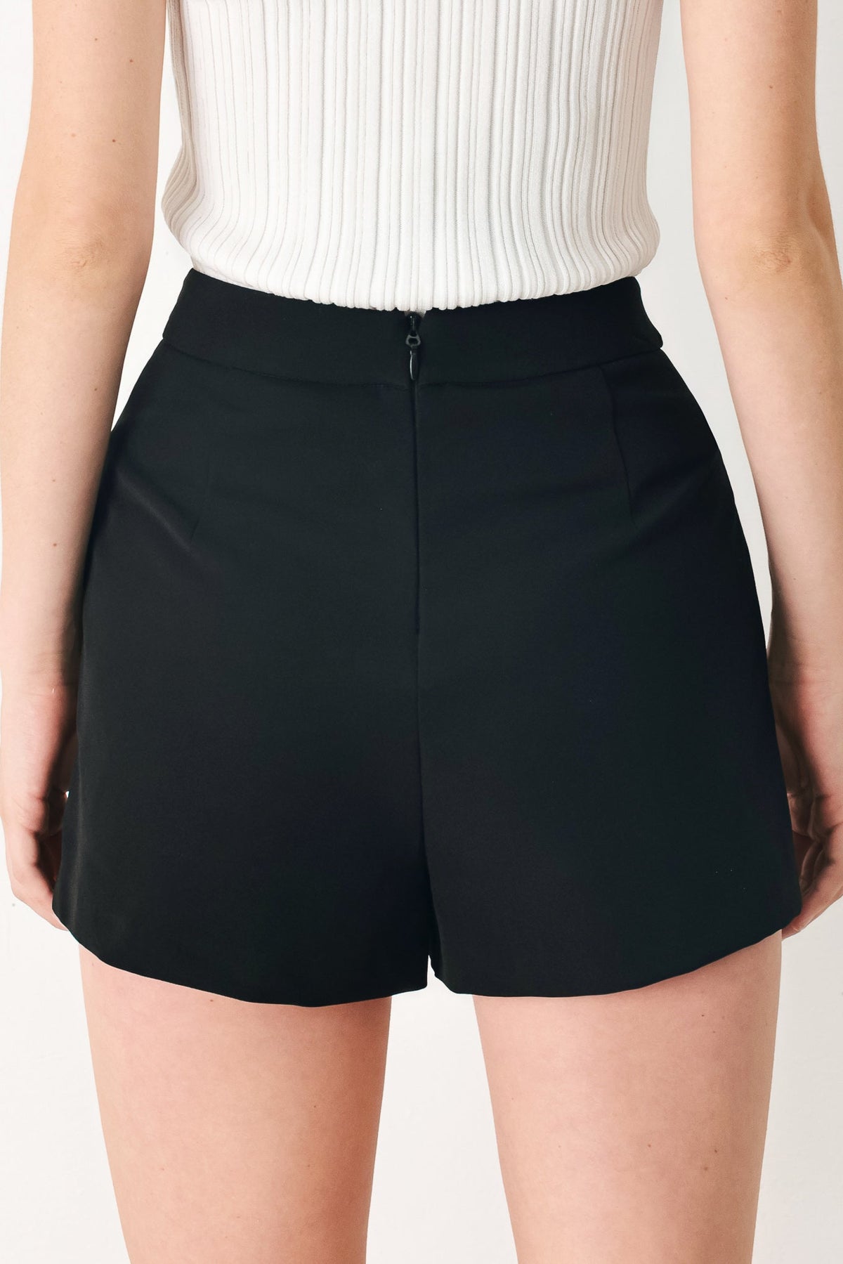 Black Flying Tomato Uptown Flirt woven skort with a fitted waistband and casual style, shown on a model.