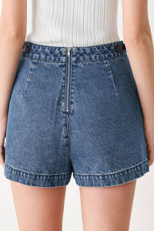 Brown vintage denim skort by Flying Tomato featuring classic denim fabric and a stylish, casual design.