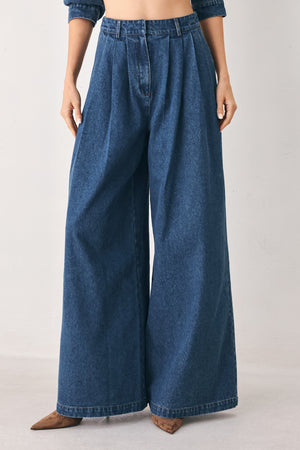 Flying Tomato blue echo pleated denim wide-leg pants with a relaxed fit and pleated front in medium indigo denim.