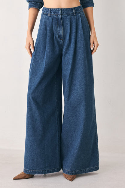 Flying Tomato blue echo pleated denim wide-leg pants with a relaxed fit and pleated front in medium indigo denim.