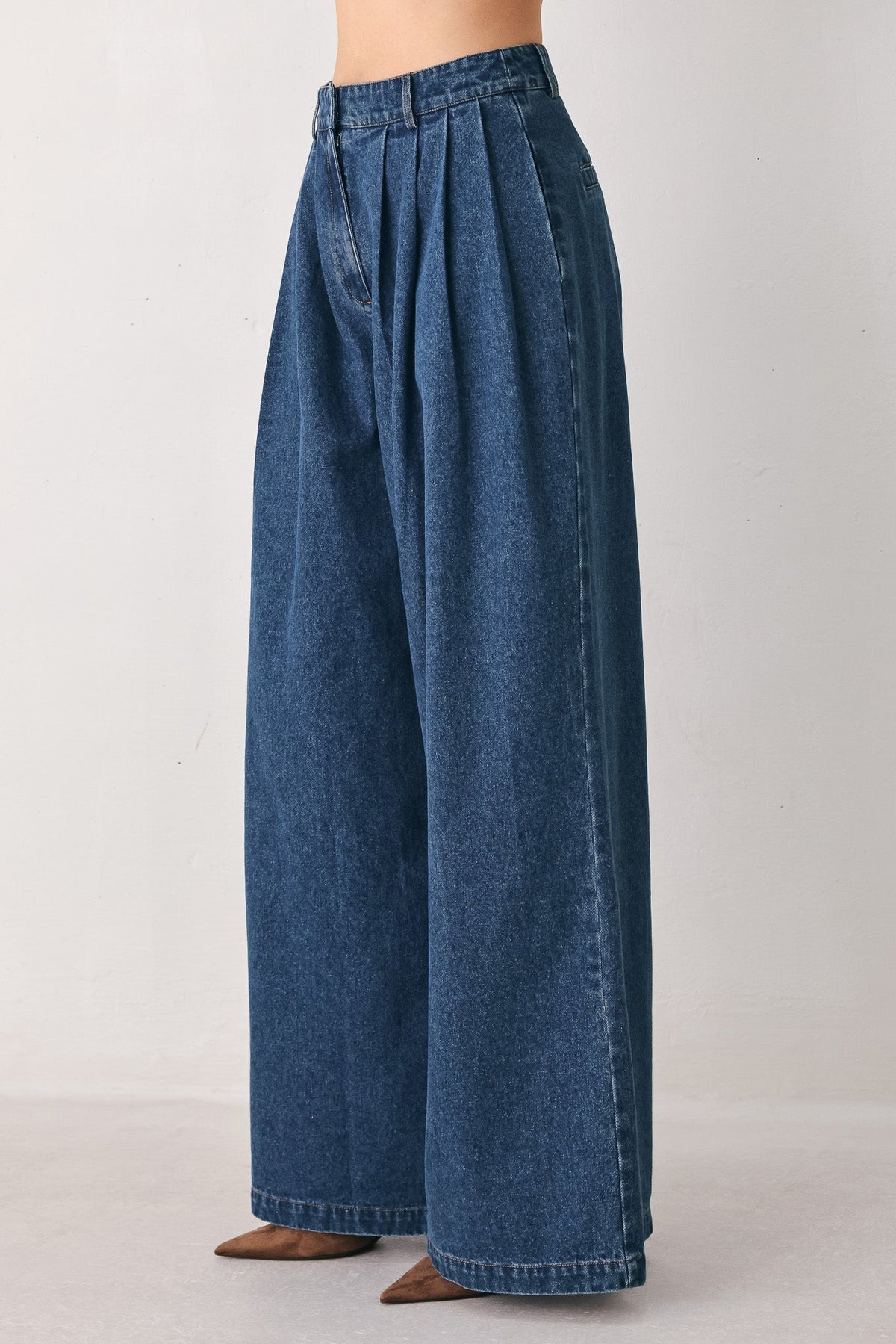 Medium indigo blue pleated denim wide-leg pants by Flying Tomato, showcasing relaxed fit and stylish design details.