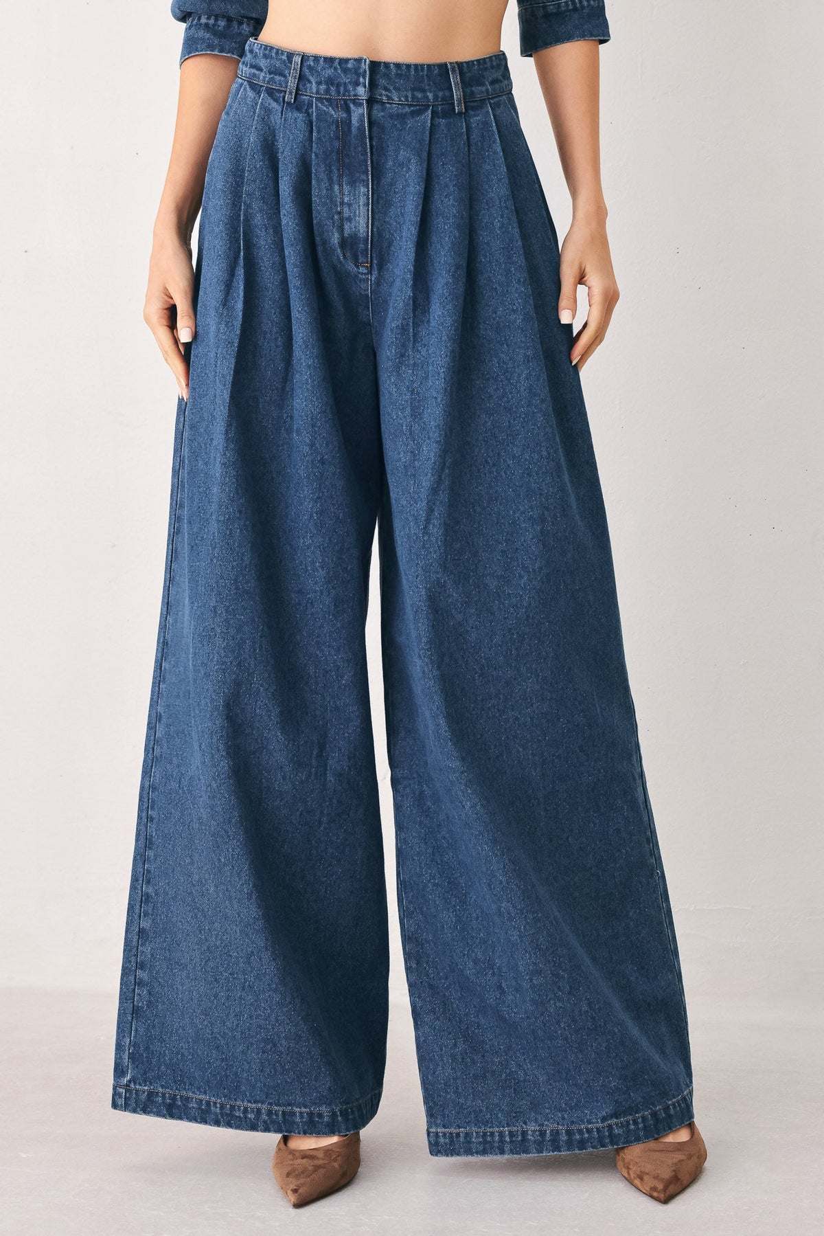 Flying Tomato blue echo pleated denim wide-leg pants with a relaxed fit, medium indigo color, and pleated details.