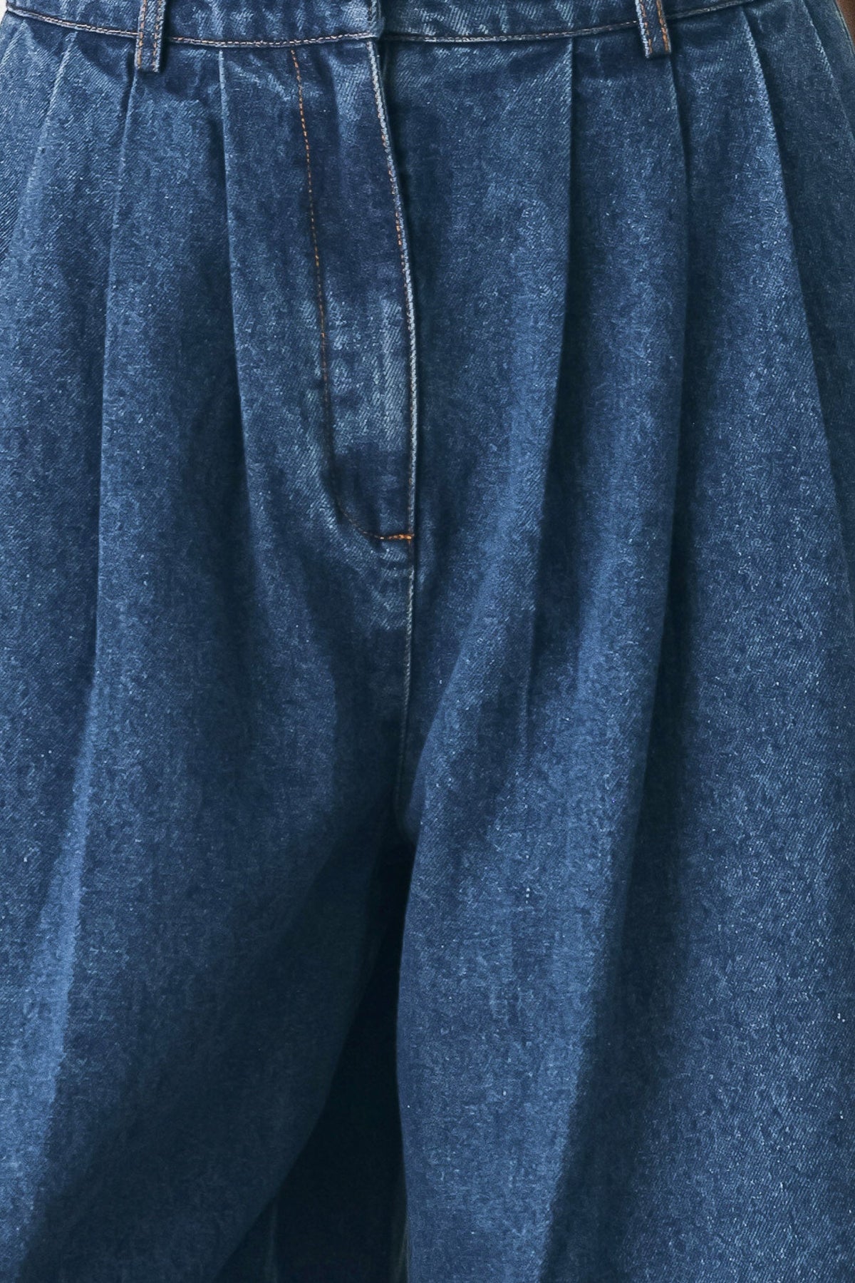 Blue Echo pleated denim wide-leg pants by Flying Tomato, shown in medium indigo with a relaxed fit and pleated design.