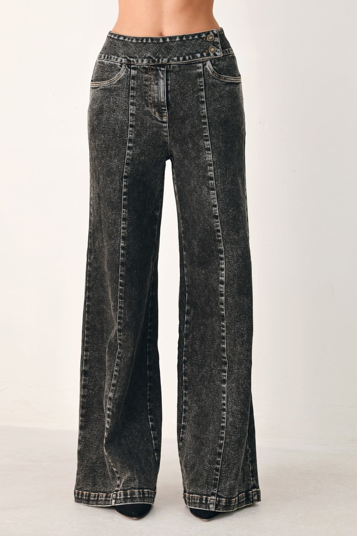 Black Flying Tomato Downtown Edge Crossover Denim Pants with stylish design and fitted waist, shown on a model.