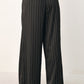 Black striped wide-leg pants from Flying Tomato's City After Dark collection, featuring a relaxed fit and stylish design.