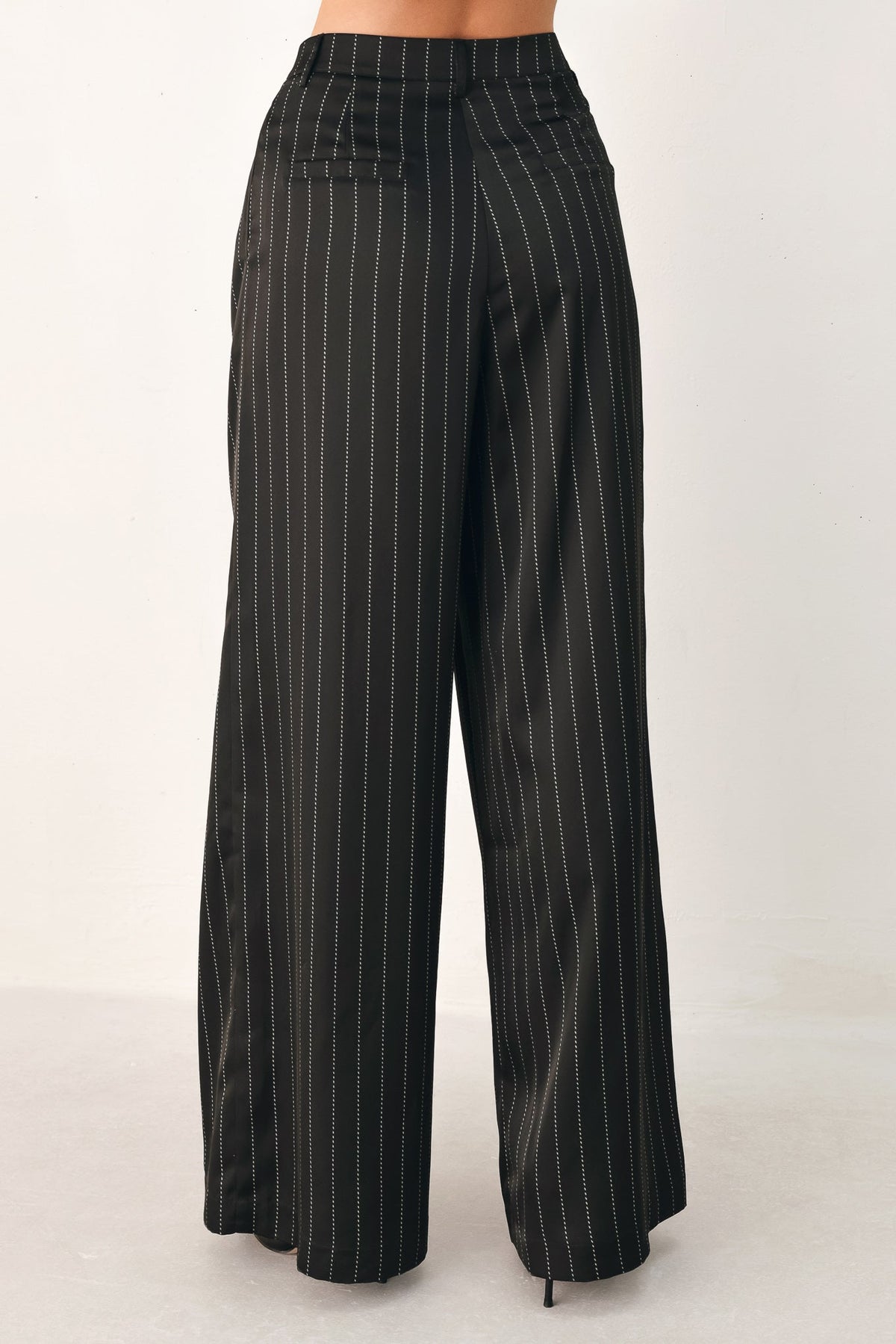 Black striped wide-leg pants from Flying Tomato's City After Dark collection, featuring a relaxed fit and stylish design.