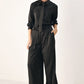 Black striped wide-leg pants by Flying Tomato from the City After Dark collection, featuring a relaxed fit and bold stripe pattern.