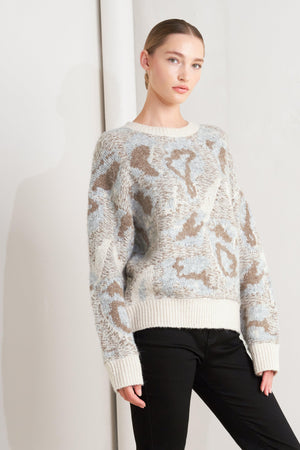 Cream and grey Flying Tomato charm pullover sweater top with a cozy fit and decorative charm accents on the front.