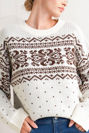 Cream and brown Snowflake Glam pullover sweater by Flying Tomato with snowflake patterns and cozy knit texture.