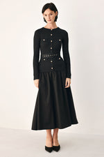 Black Flying Tomato City After Dark mixed media midi dress displayed on a hanger with a sleek, modern design.