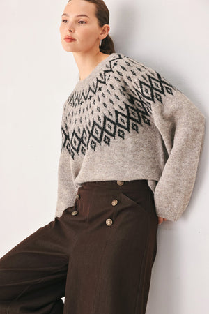 Flying Tomato Cabin Light Serenade sweater knit pullover in taupe featuring a cozy, casual design with ribbed cuffs and neckline.