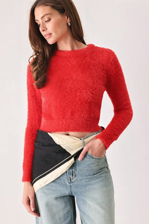 Red fuzzy sweater top from Flying Tomato, cozy and stylish, featuring a plush textured design and long sleeves.