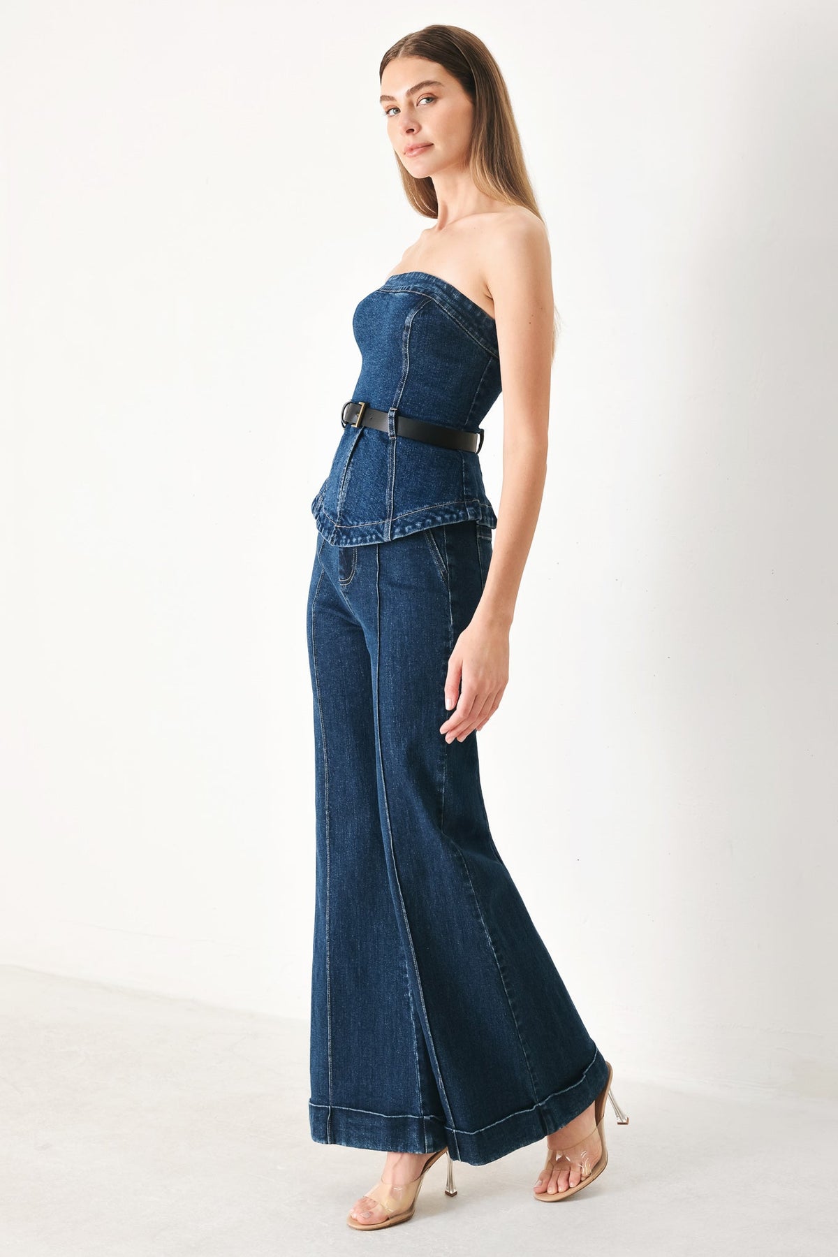 Flying Tomato Skyline Flare Denim Tube Top in indigo denim, shown on a hanger with a close-up of the fabric and design details.