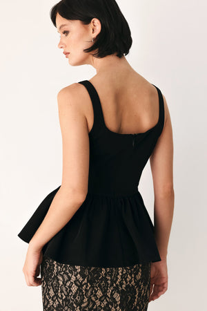 Black Flying Tomato Midnight Romance square neck peplum top with fitted bodice and stylish design, displayed on a hanger.
