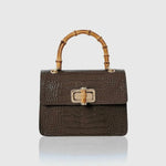 Black mini Harriet bag by thebagicon, featuring a compact design with a top handle and sleek leather finish.