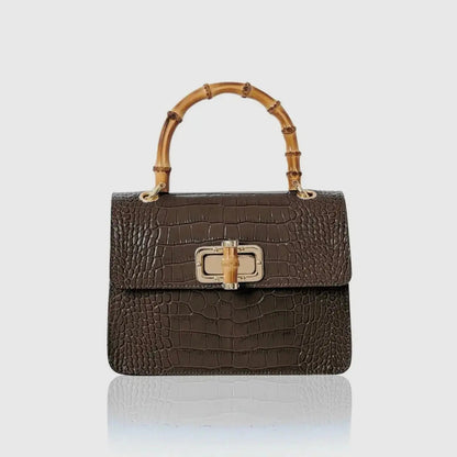 Black mini Harriet bag by thebagicon, featuring a compact design with a top handle and sleek leather finish.