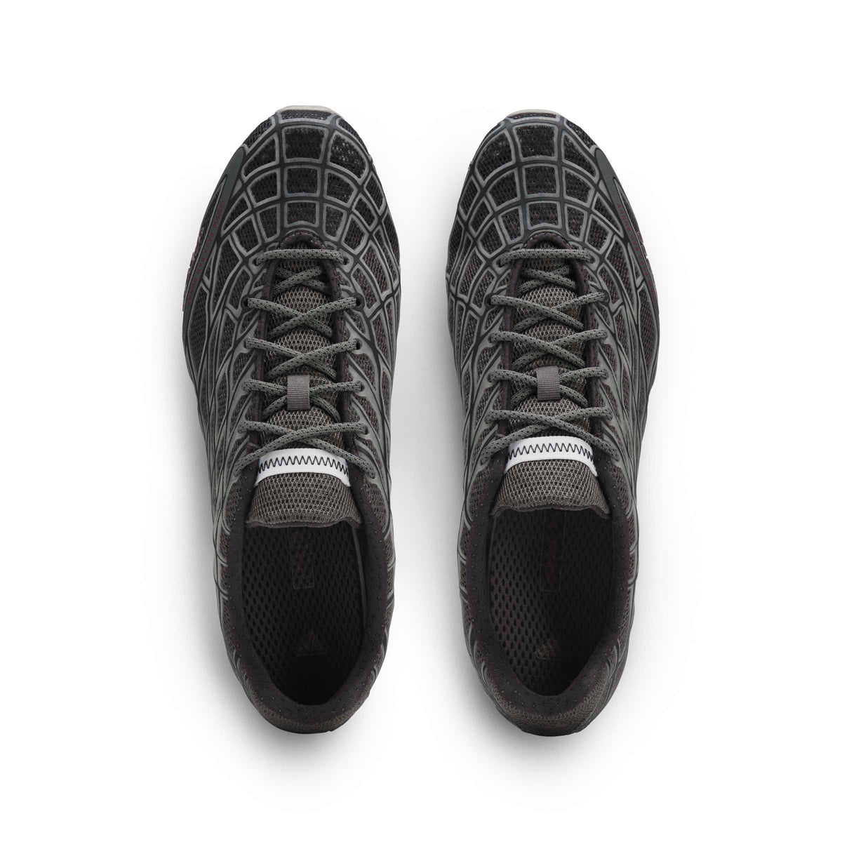 Black Adidas x Bad Bunny Mens F50 footwear with white accents, shown from a top portrait view.