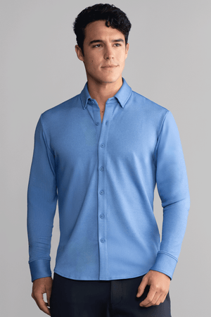 Blue long sleeve button-down polo shirt in herringbone pattern by Twillory, front view showcasing classic collar and button details.