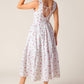 Flying Tomato Thena Garden Party woven eyelet midi dress in white and pink, featuring floral embroidery and delicate eyelet details.