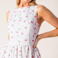 Flying Tomato Thena Garden Party woven eyelet midi dress in white and pink, featuring a feminine, floral design and elegant midi length.