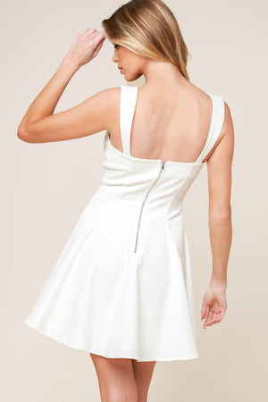 White denim woven mini dress by Flying Tomato, featuring a stylish and casual design perfect for summer or casual outings.