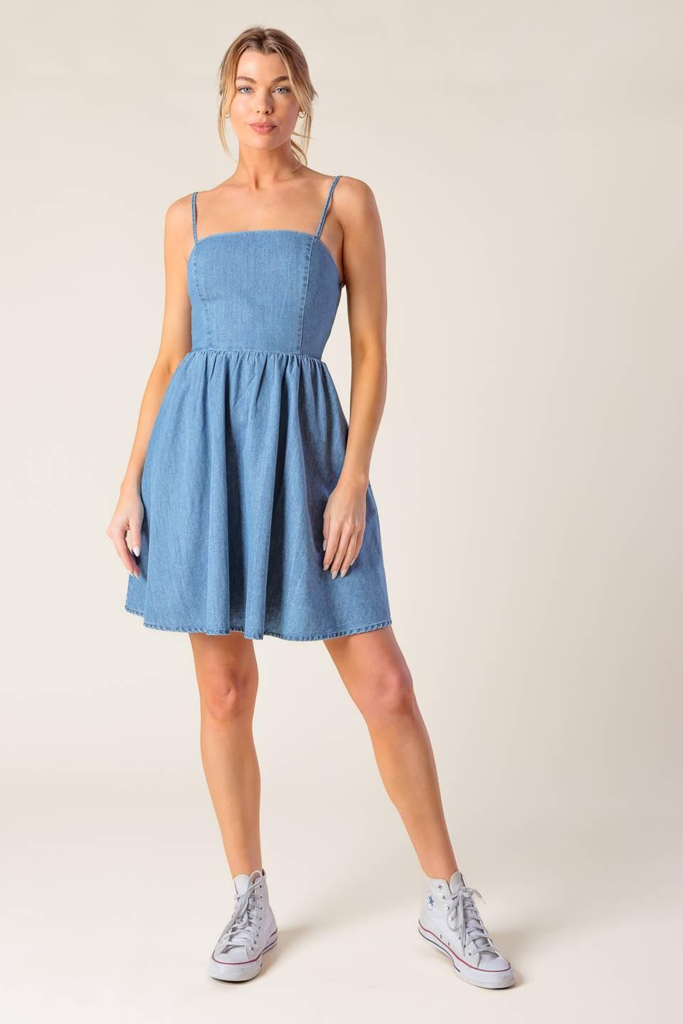Light indigo Flying Tomato Back in Love Denim Mini Dress, casual sleeveless dress with a fitted silhouette and front button details.