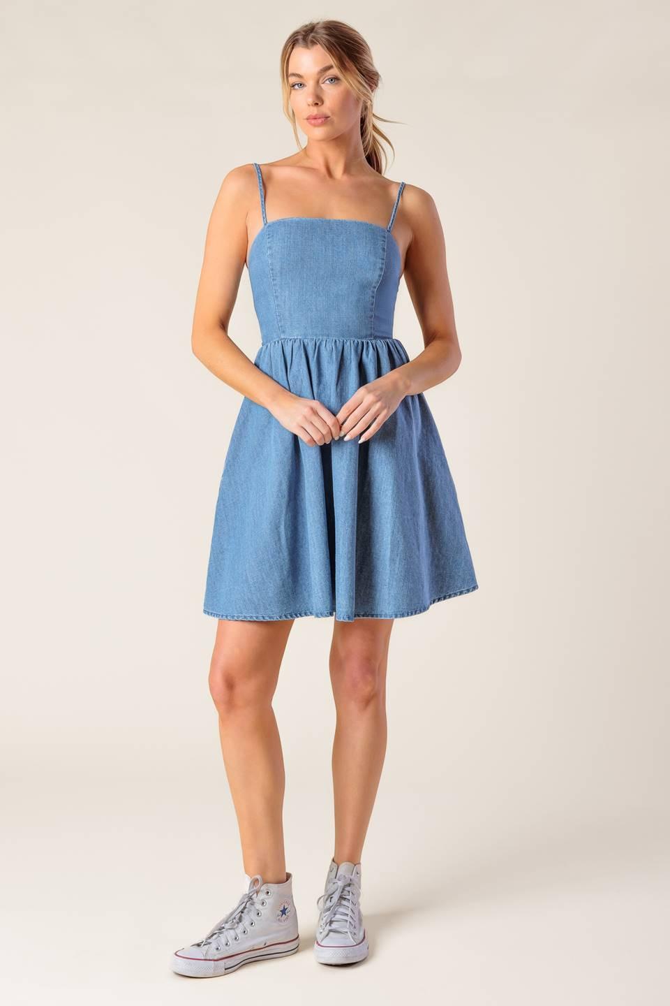 Light indigo Flying Tomato Back in Love Denim Mini Dress, casual sleeveless dress with front pockets and fitted waist.