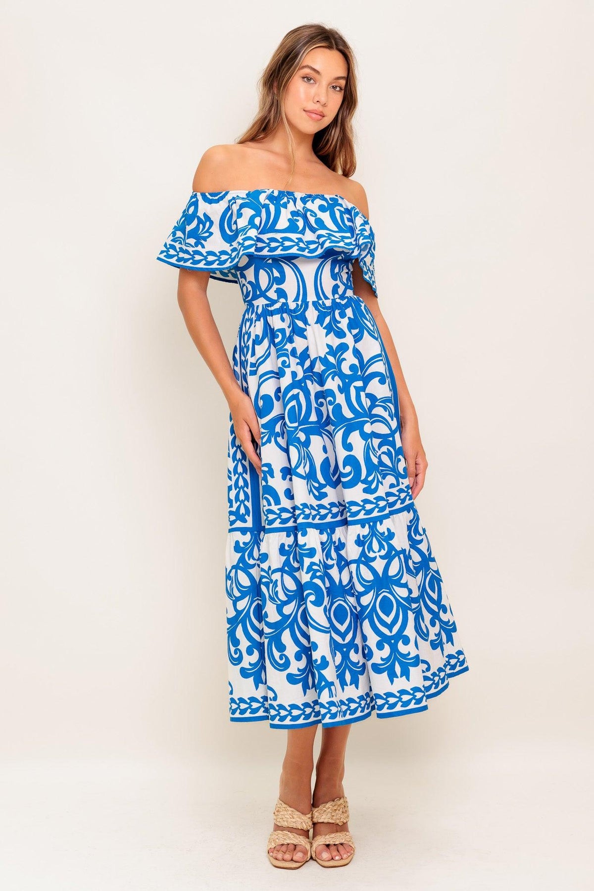 Flying Tomato Bloom Serenade blue woven midi dress featuring a flowy silhouette and floral pattern, sleeveless with adjustable straps.