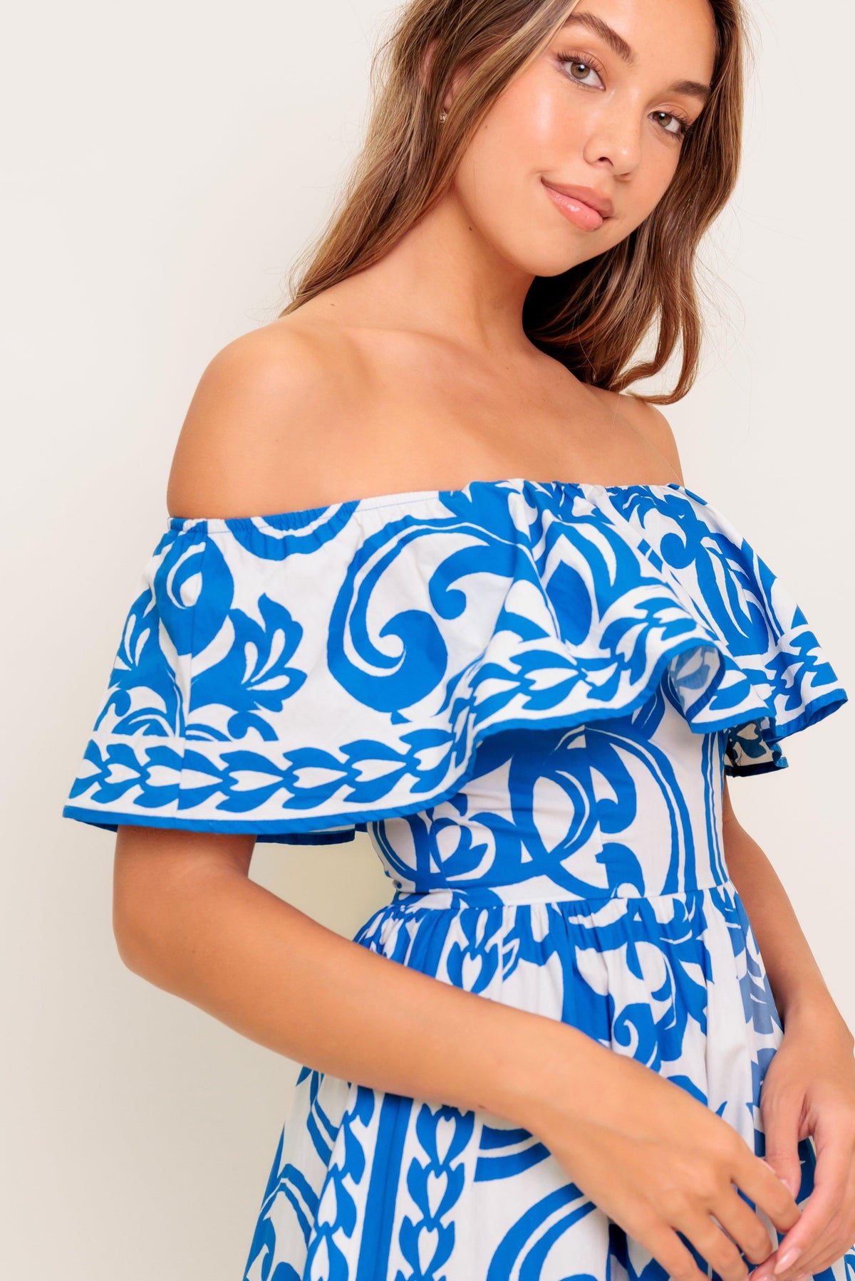 Flying Tomato Bloom Serenade blue woven midi dress with floral pattern, sleeveless design, and flowing fabric.